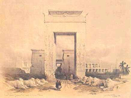 A tall arch or gate with a flared top standing alone.